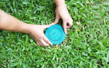 Installing a termite bait station in Moore County NC - Aberdeen Exterminating